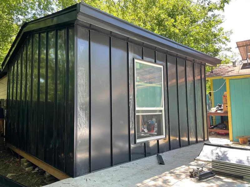 Black standing seam metal wall panels for Metal Roof Installation in Delhi Hills